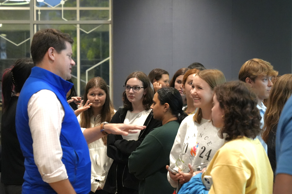 Groups of students speak with College of Sciences alumni during a College of Sciences - Career Center networking event