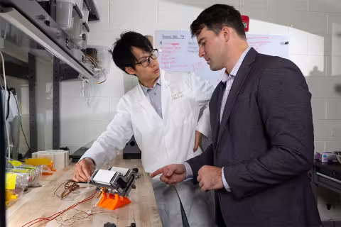 Trenton Gantt and Hugh (Ka Yui) Chen work together in the lab