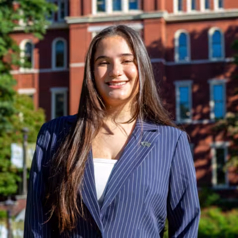 Headshot of Giuli Capparelli Sanabria in front of Tech Tower