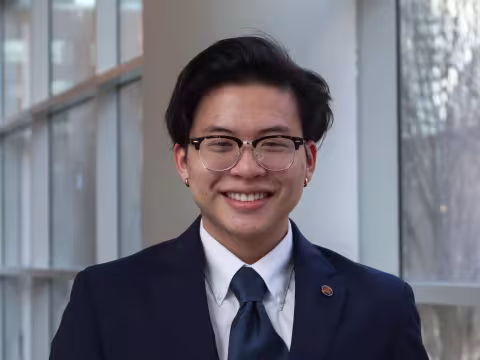 Elliot Huang is wearing a suit for this headshot